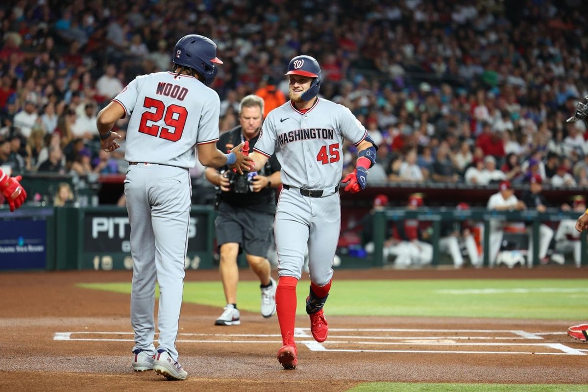 Jun 6, 2026; Phoenix, Arizona, USA; Washington Nationals third baseman Curtis Mead (45) high fives Washington Nationals designated hitter James Wood (29) after hitting a two run home run against Arizona Diamondbacks pitcher Eduardo Rodriguez (57) in the first inning at Chase Field. Mandatory Credit: Anna Carrington-Imagn Images