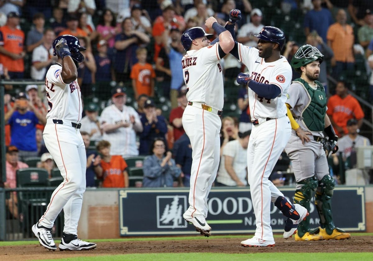 Jun 6, 2026; Houston, Texas, USA;  Houston Astros catcher Christian Vázquez (2) celebrates designated hitter Yordan Alvarez (44) a grand slam against the Athletics in the second inning at Daikin Park. Mandatory Credit: Thomas Shea-Imagn Images