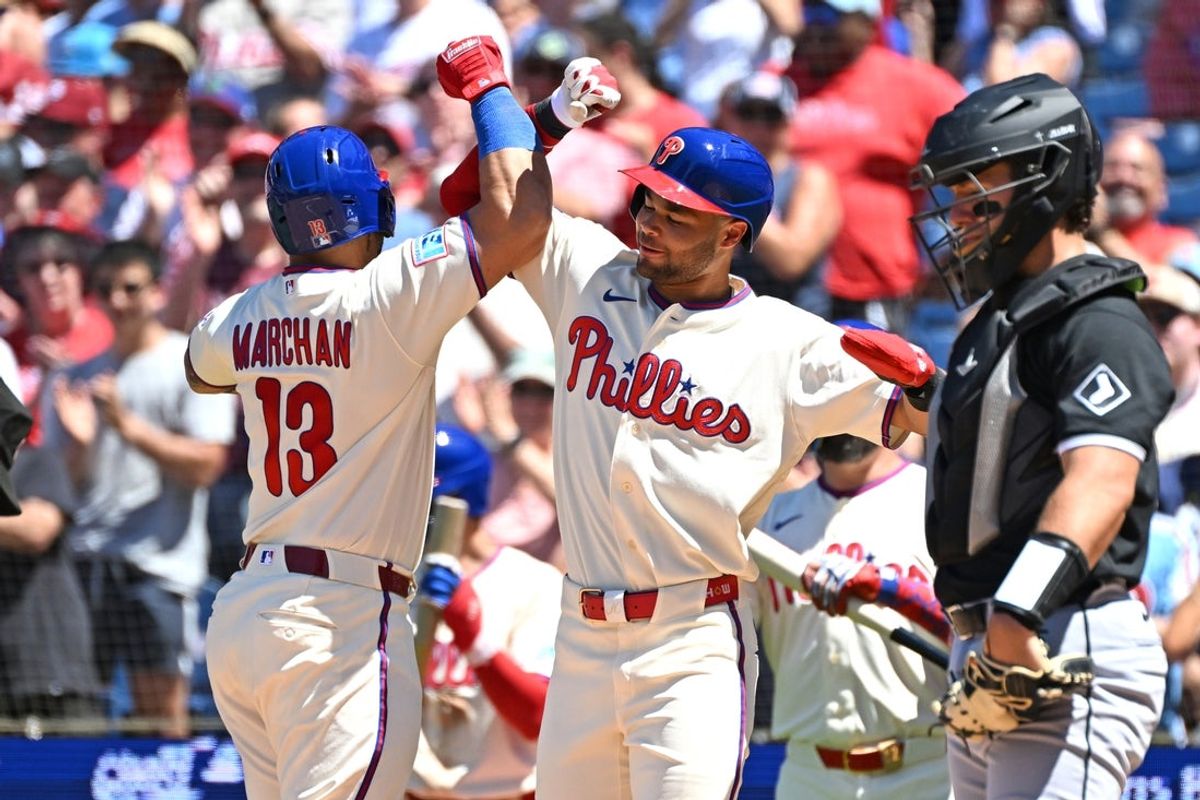 Jun 7, 2026; Philadelphia, Pennsylvania, USA;  Philadelphia Phillies catcher Rafael Marchán (13) celebrates his two-run home run with center fielder Justin Crawford (2) against the Chicago White Sox during the second inning at Citizens Bank Park. Mandatory Credit: Eric Hartline-Imagn Images