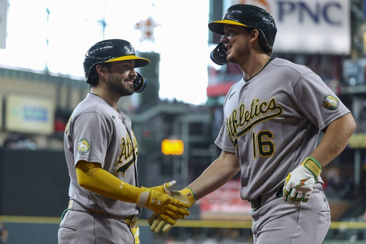 Jun 7, 2026; Houston, Texas, USA; Athletics first baseman Nick Kurtz (16) celebrates with catcher Shea Langeliers (23) after hitting a home run during the third inning against the Houston Astros at Daikin Park. Mandatory Credit: Troy Taormina-Imagn Images