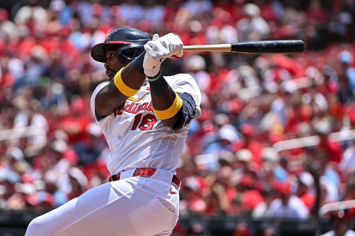 Jun 7, 2026; St. Louis, Missouri, USA; St. Louis Cardinals right fielder Jordan Walker (18) hits a single against the Cincinnati Reds during the first inning at Busch Stadium. Mandatory Credit: Jeff Curry-Imagn Images