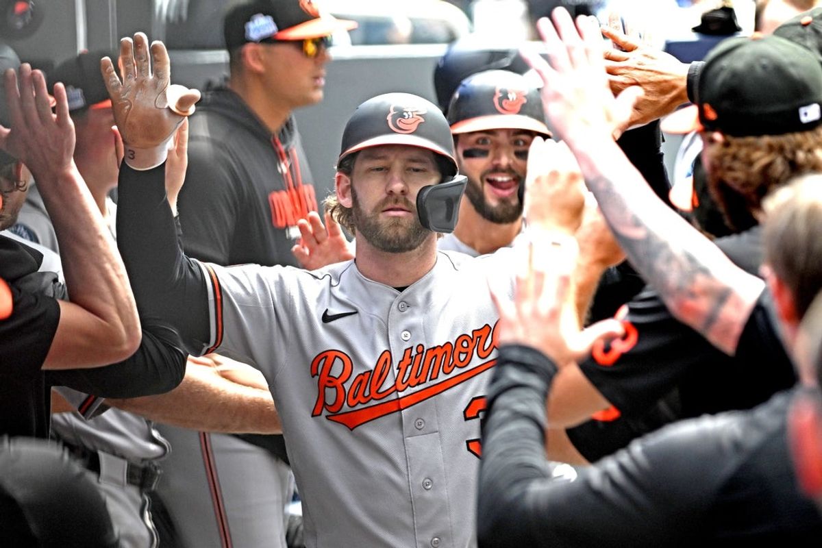 Jun 7, 2026; Toronto, Ontario, CAN; Baltimore Orioles left fielder Taylor Ward (3) celebrates in the dugout with teammates after hitting a two run home run against the Toronto Blue Jays in the fifth inning at Rogers Centre. Mandatory Credit: Dan Hamilton-Imagn Images