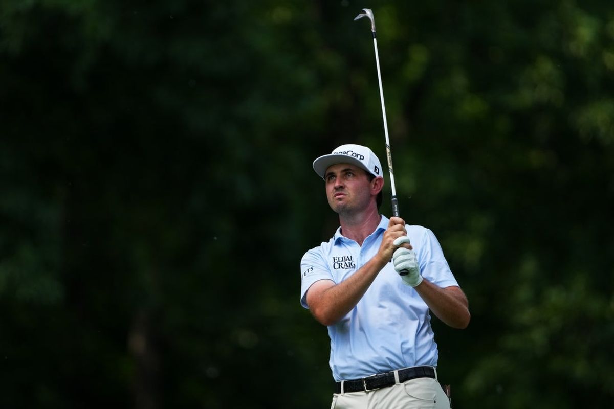 Jun 7, 2026; Dublin, Ohio, USA;  J.T. Poston plays his shot from the fairway on the ninth hole during the final round of the Memorial Tournament presented by Workday golf tournament. Mandatory Credit: Aaron Doster-Imagn Images