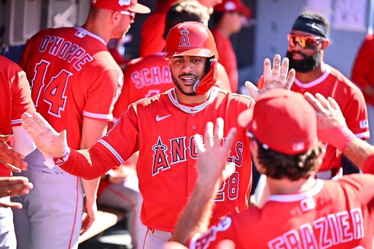 Jun 7, 2026; Los Angeles, California, USA;  Los Angeles Angels left fielder Jose Siri (28) is greeted in the dugout after scoring against the Los Angeles Dodgers during the ninth inning at Dodger Stadium. Mandatory Credit: William Liang-Imagn Images
