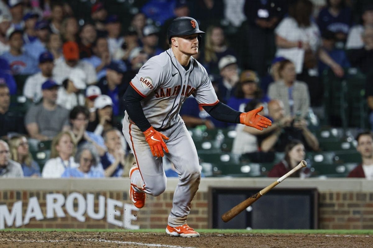 Jun 7, 2026; Chicago, Illinois, USA; San Francisco Giants third baseman Matt Chapman (26) hits an RBI-single against the Chicago Cubs during the 10th inning at Wrigley Field. Mandatory Credit: Kamil Krzaczynski-Imagn Images