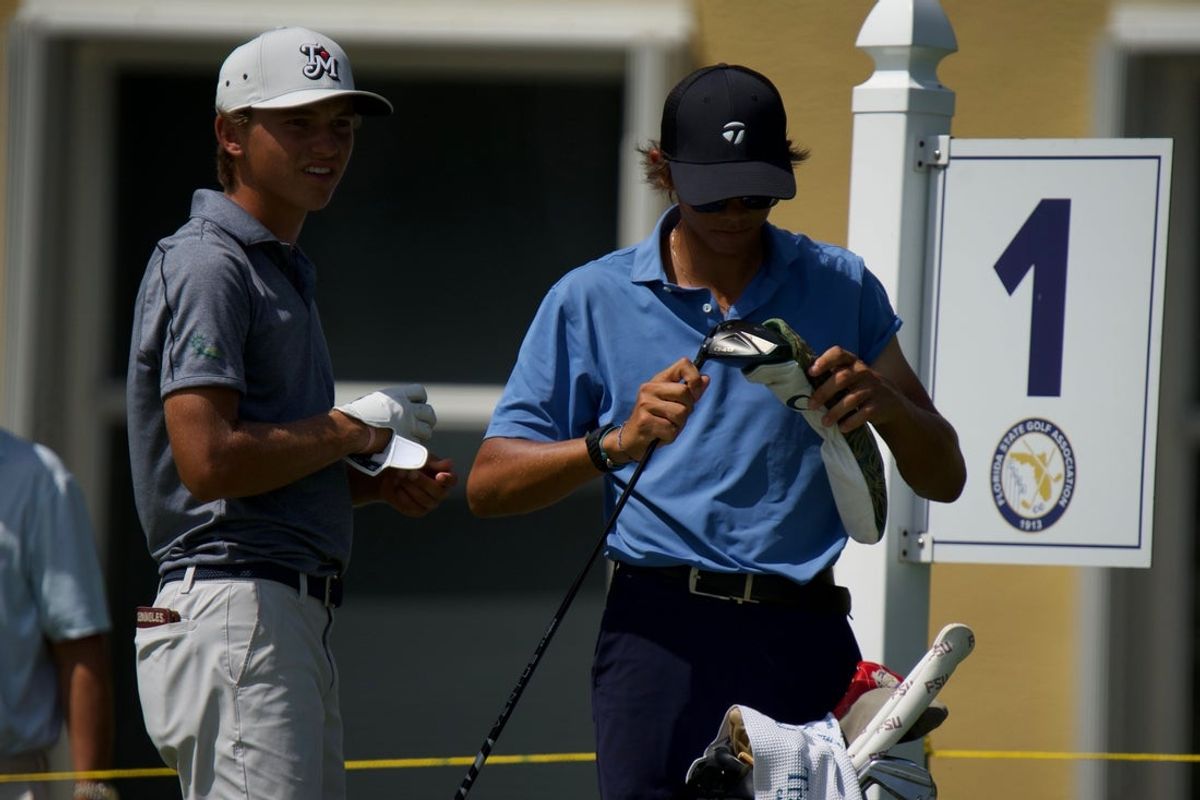Miles Russell (left) and his caddy Charlie Woods (right) compete in the 2026 U.S. Open qualifier at BallenIsles Country Club (East) on Monday, June 8, 2026 in Palm Beach Gardens, Florida.