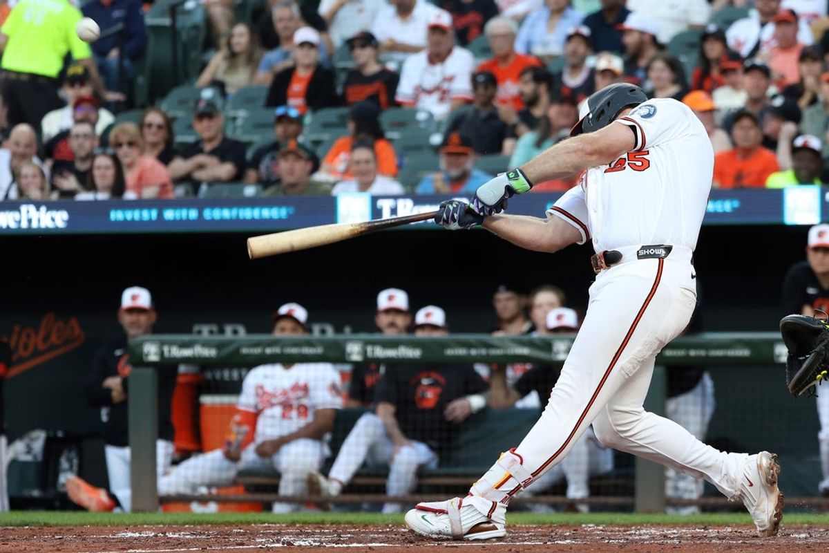 Jun 8, 2026; Baltimore, Maryland, USA; Baltimore Orioles first baseman Pete Alonso (25) hits a sacrifice fly to score a run during the third inning against the Seattle Mariners at Oriole Park at Camden Yards. Mandatory Credit: Daniel Kucin Jr.-Imagn Images