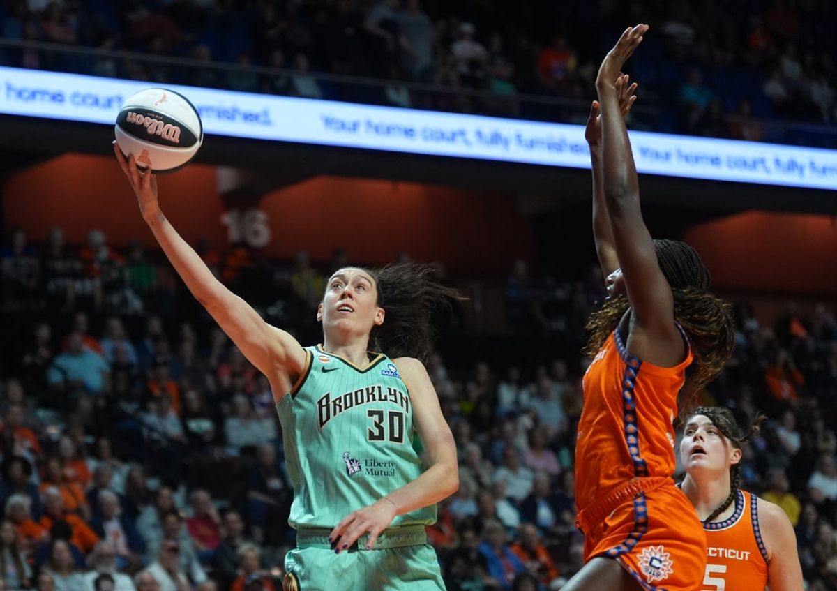 Jun 8, 2026; Uncasville, Connecticut, USA; New York Liberty forward Breanna Stewart (30) drives the ball to the basket against Connecticut Sun forward Diamond Miller (1) in the first half at Mohegan Sun Arena. Mandatory Credit: David Butler II-Imagn Images