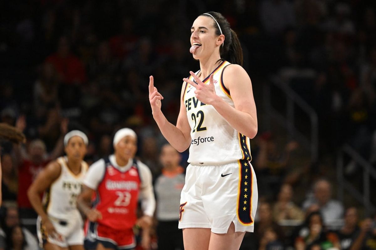 Jun 8, 2026; Washington, District of Columbia, USA; Indiana Fever guard Caitlin Clark (22) reacts after making a three-point basket against the Washington Mystics during the first quarter at CareFirst Arena. Mandatory Credit: Rafael Suanes-Imagn Images