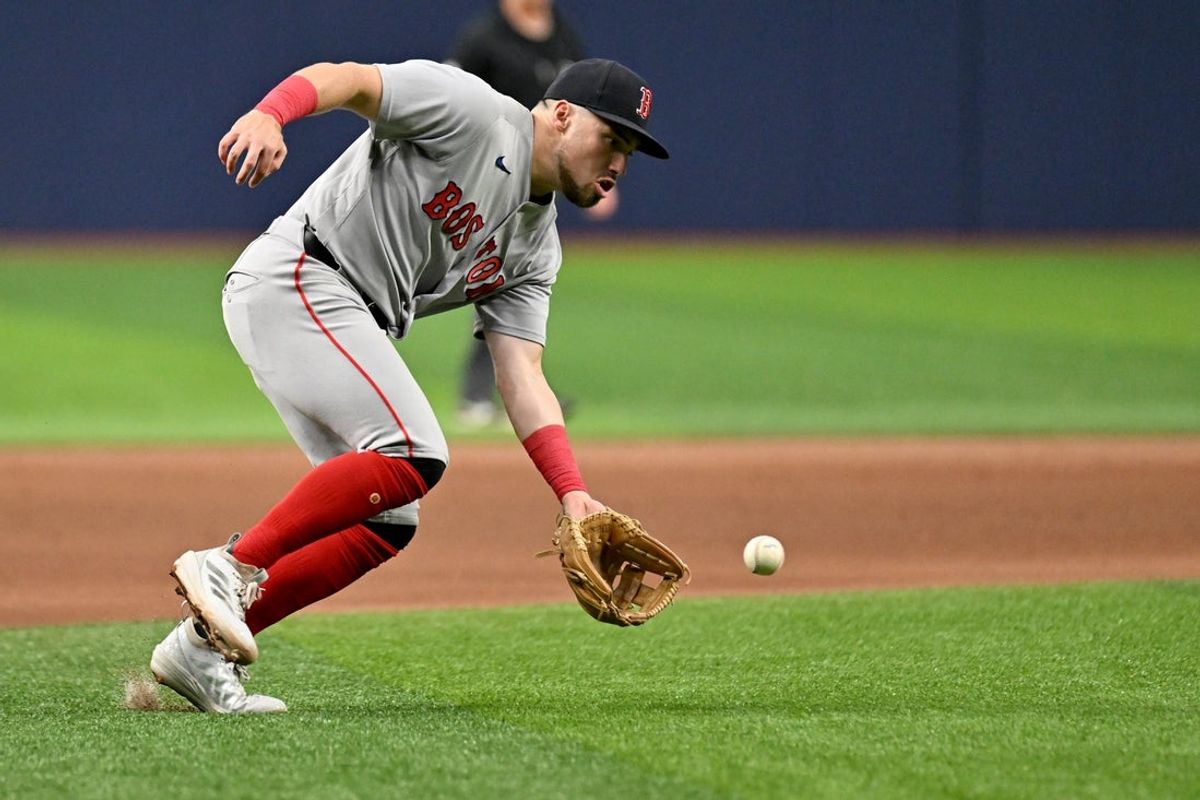 Jun 8, 2026; St. Petersburg, Florida, USA;  Boston Red Sox third baseman Caleb Durbin (5) fields a ground ball in the fifth inning against the Tampa Bay Rays  at Tropicana Field. Mandatory Credit: Jonathan Dyer-Imagn Images