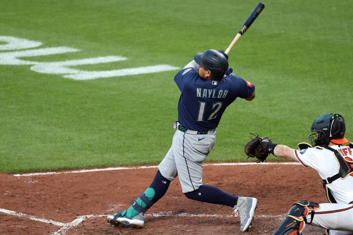 Jun 8, 2026; Baltimore, Maryland, USA; Seattle Mariners first baseman Josh Naylor (12) hits a grand slam during the  fifth inning against the Baltimore Orioles at Oriole Park at Camden Yards. Mandatory Credit: Daniel Kucin Jr.-Imagn Images