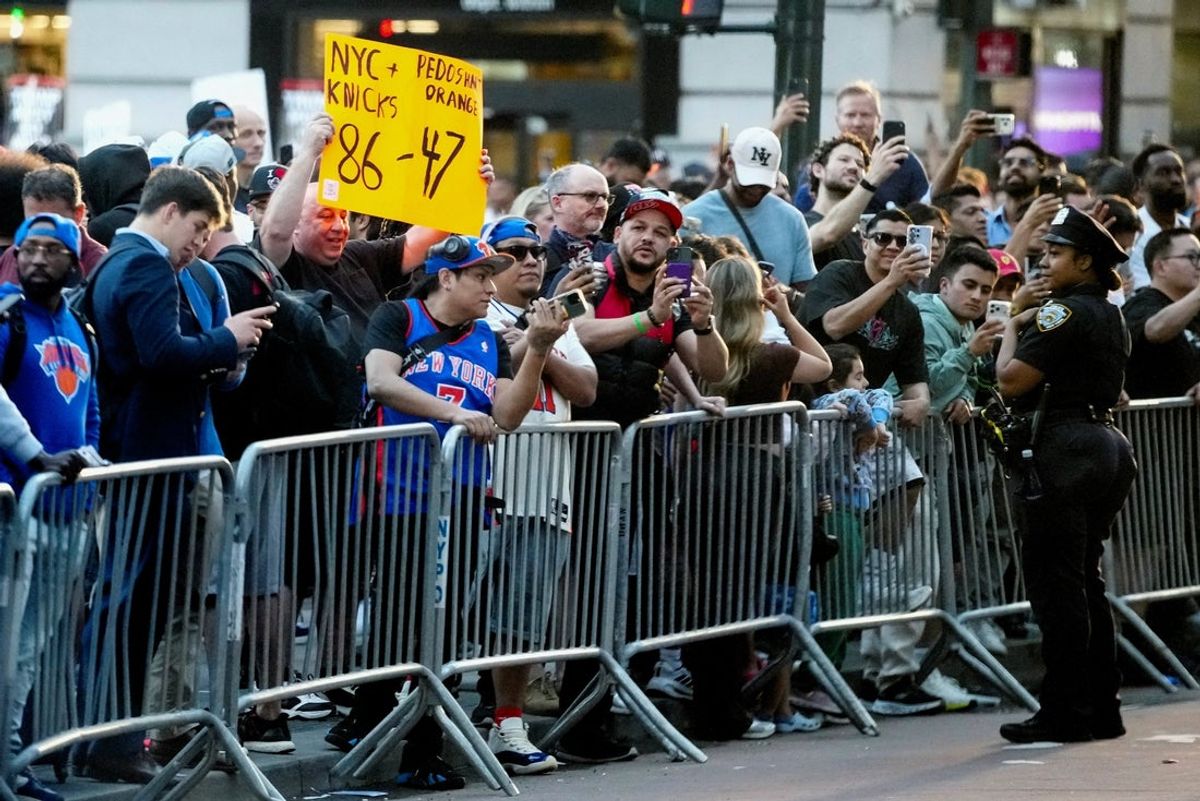 [US, Mexico & Canada customers only] Jun 8, 2026; New York, New York, USA; People gather behind barricades outside Madison Square Garden before game three of the NBA Finals. Mandatory Credit: Nathan Howard-Reuters via Imagn Images