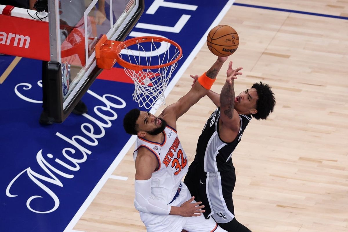 Jun 8, 2026; New York, New York, USA; San Antonio Spurs guard Dylan Harper (2) shoots the ball against New York Knicks center Karl-Anthony Towns (32) during game three of the 2026 NBA Finals in the third quarter at Madison Square Garden. Mandatory Credit: Wendell Cruz-Imagn Images