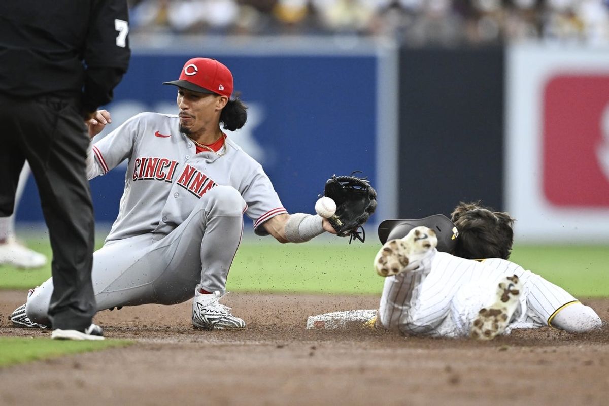Jun 8, 2026; San Diego, California, USA; San Diego Padres center fielder Jase Bowen (4) steals second base ahead of the tag of Cincinnati Reds second baseman Edwin Arroyo (2) during the second inning at Petco Park. Mandatory Credit: Denis Poroy-Imagn Images