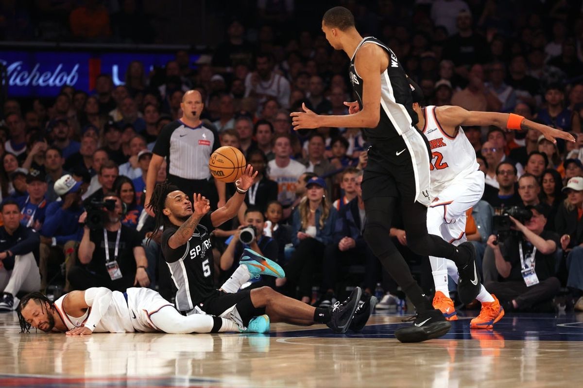 Jun 8, 2026; New York, New York, USA; San Antonio Spurs guard Stephon Castle (5) passes the ball to San Antonio Spurs forward Victor Wembanyama (1) against New York Knicks guard Jalen Brunson (11) and center Karl-Anthony Towns (32) during game three of the 2026 NBA Finals in the third quarter at Madison Square Garden. Mandatory Credit: Geoff Burke-Imagn Images