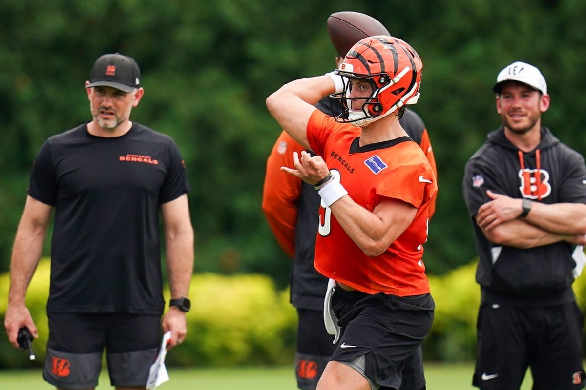 Cincinnati Bengals quarterback Joe Burrow (9) throws a pass to a teammate during practice on Tuesday, June 9, 2026, at Kettering Health Practice Fields in downtown Cincinnati.