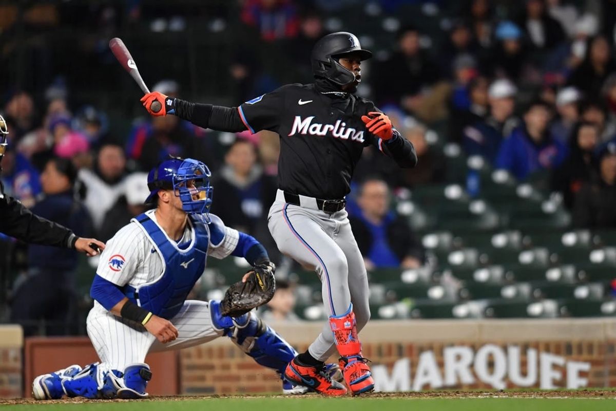 Apr 20, 2024; Chicago, Illinois, USA; Miami Marlins center fielder Jazz Chisholm Jr. (2) hits an RBI single during the fourth inning against the Chicago Cubs at Wrigley Field.