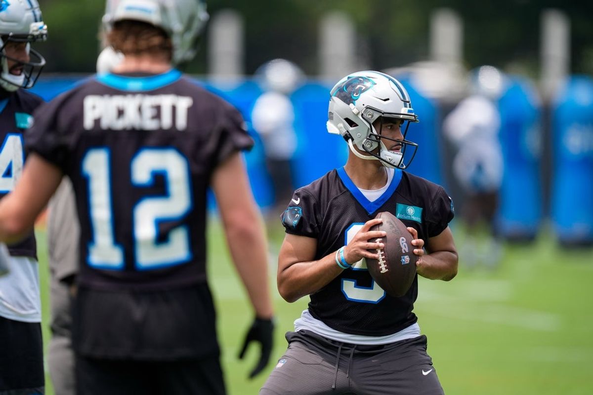 Jun 9, 2026; Charlotte, NC, USA;  Carolina Panthers quarterback Will Grier (14) and quarterback Kenny Pickett (12) watch quarterback Bryce Young (9) during the first day of mini camp at Bank of America Stadium practice facility. Mandatory Credit: Jim Dedmon-Imagn Images