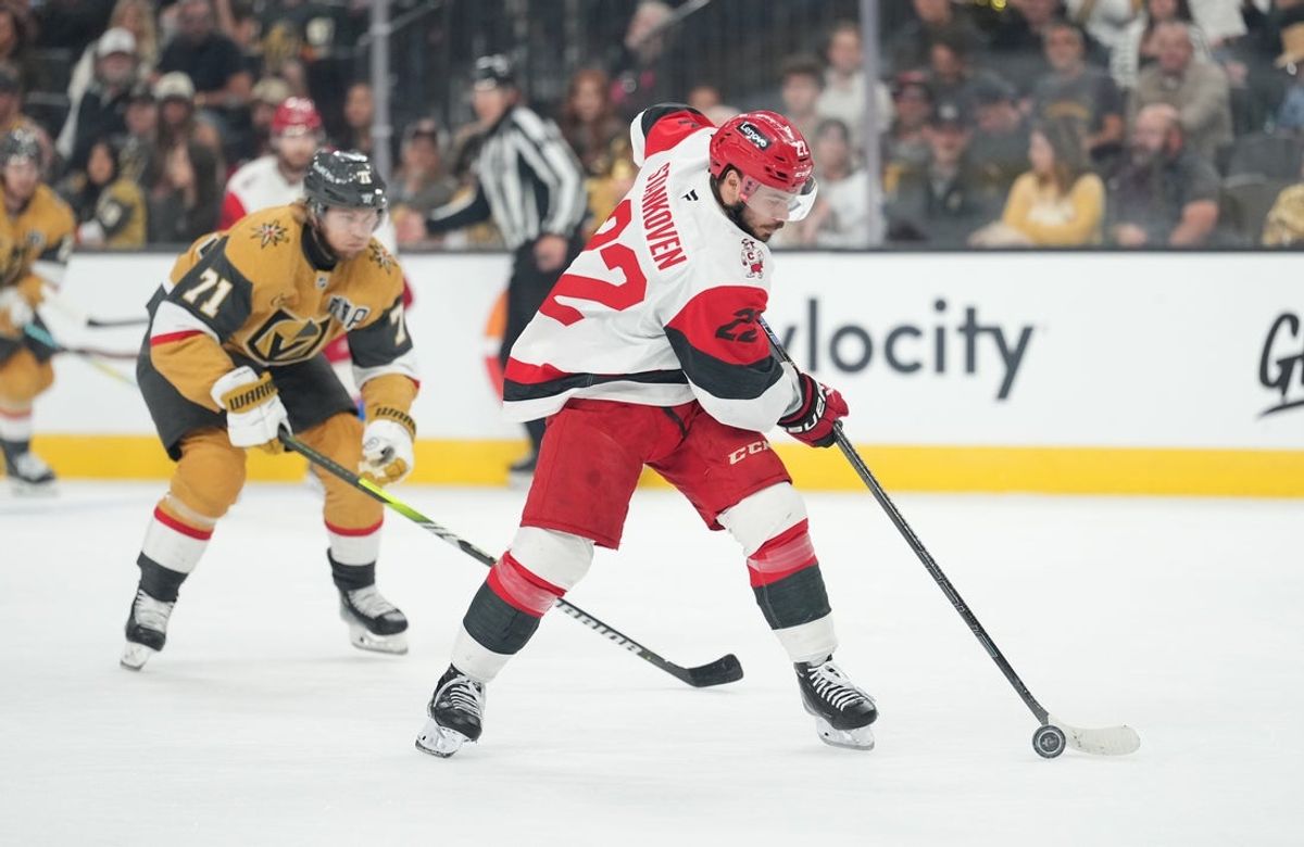 Jun 9, 2026; Las Vegas, Nevada, USA; Carolina Hurricanes center Logan Stankoven (22) carries the puck in front of Vegas Golden Knights center William Karlsson (71) during the 1st period in game four of the 2026 Stanley Cup Final at T-Mobile Arena. Mandatory Credit: Lucas Peltier-Imagn Images