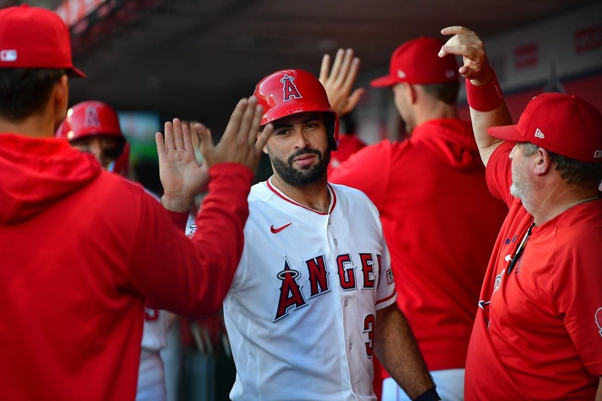 Jun 9, 2026; Anaheim, California, USA; Los Angeles Angels catcher Sebastian Rivero (38) is greeted after scoring a run against the Houston Astros during the second inning at Angel Stadium. Mandatory Credit: Gary A. Vasquez-Imagn Images