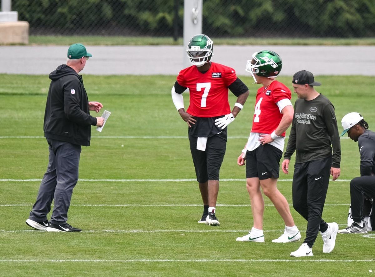 Jun 10, 2026; Florham Park, NY, USA; New York Jets quarterback Geno Smith (7) and quarterback Brady Cook (4) participate in a drill during minicamp at Atlantic Health Jets Training Center. Mandatory Credit: John Jones-Imagn Images