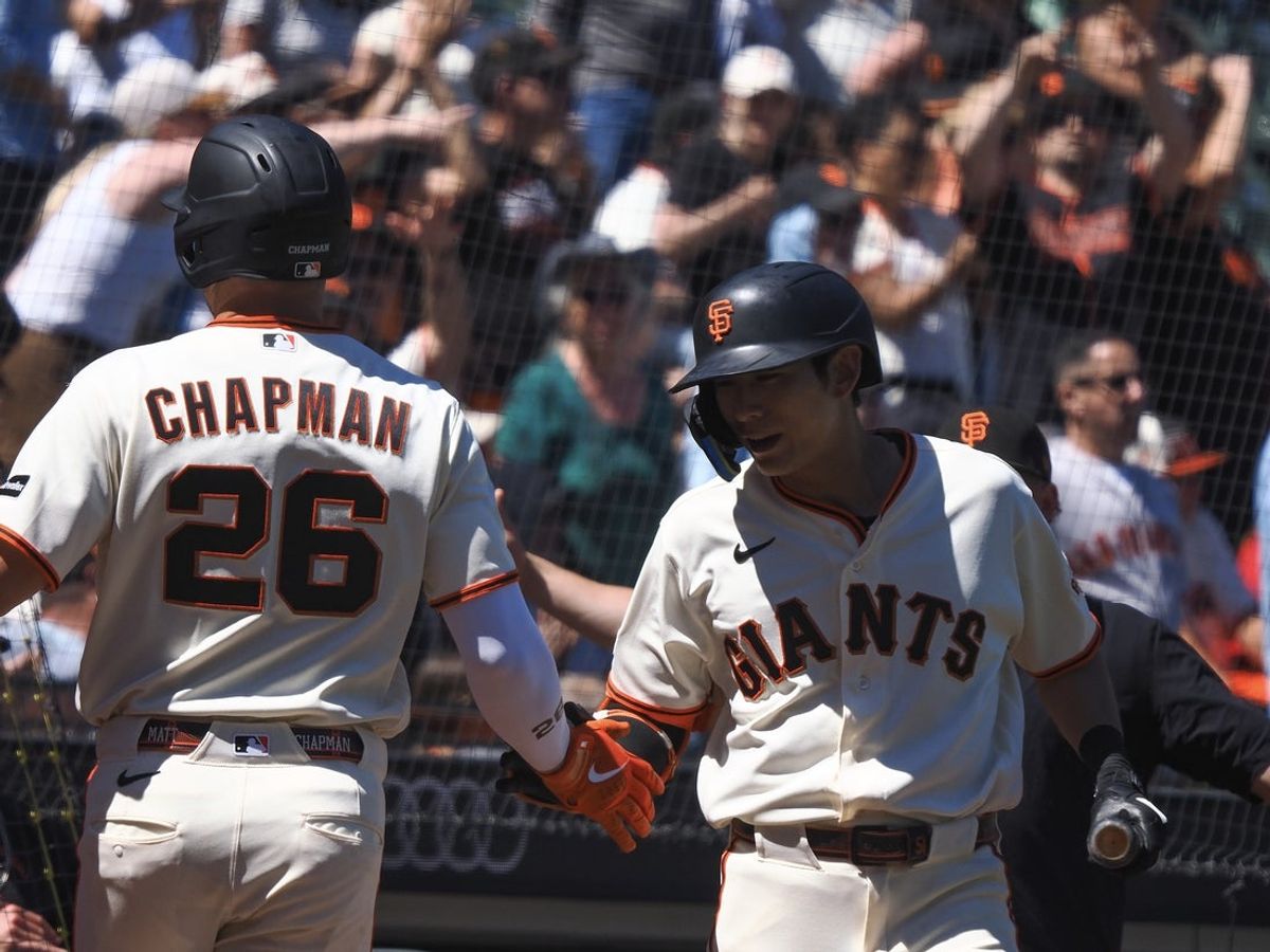 Jun 10, 2026; San Francisco, California, USA; San Francisco Giants third baseman Matt Chapman (26) celebrates with right fielder Jung Hoo Lee (51) after hitting a home run against the Washington Nationals during the eighth inning at Oracle Park. Mandatory Credit: Kelley L Cox-Imagn Images