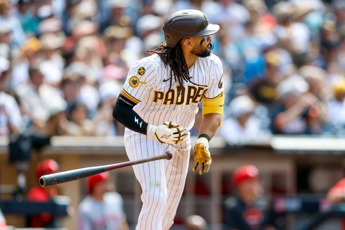 Jun 10, 2026; San Diego, California, USA; San Diego Padres second baseman Fernando Tatis Jr. (23) hits a one run home run during the ninth inning against the Cincinnati Reds at Petco Park. Mandatory Credit: David Frerker-Imagn Images