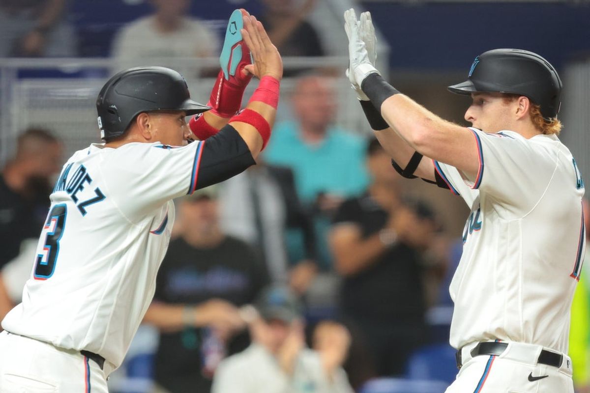 Jun 10, 2026; Miami, Florida, USA; Miami Marlins right fielder Owen Caissie (17) celebrates with left fielder Heriberto Hernandez (13) after hitting a two-run home run against the Arizona Diamondbacks during the fourth inning at loanDepot Park. Mandatory Credit: Sam Navarro-Imagn Images