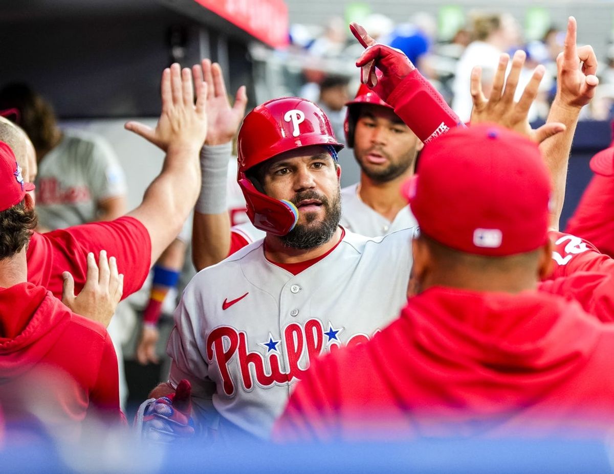 Jun 10, 2026; Toronto, Ontario, CAN;  Philadelphia Phillies designated hitter Kyle Schwarber (12) celebrates hitting a home run against the Toronto Blue Jays during the fourth inning with teammates at Rogers Centre. Mandatory Credit: Kevin Sousa-Imagn Images