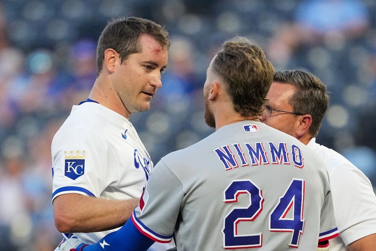 Jun 10, 2026; Kansas City, Missouri, USA; Texas Rangers right fielder Brandon Nimmo (24) talks with Kansas City Royals starting pitcher Seth Lugo (67) after his line drive single hit Lugo during the fourth inning at Kauffman Stadium. Mandatory Credit: Denny Medley-Imagn Images