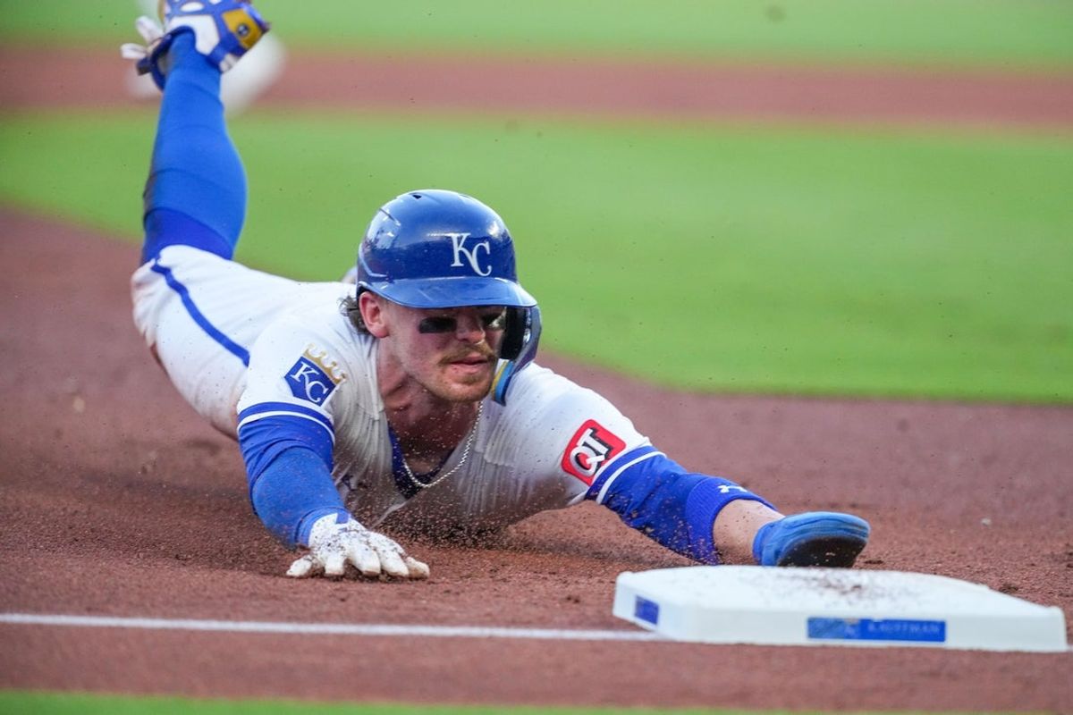 Jun 10, 2026; Kansas City, Missouri, USA; Kansas City Royals shortstop Bobby Witt Jr. (7) steals third base against the Texas Rangers during the third inning at Kauffman Stadium. Mandatory Credit: Denny Medley-Imagn Images
