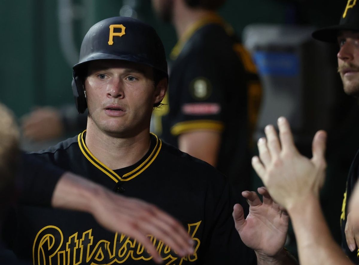 Jun 10, 2026; Pittsburgh, Pennsylvania, USA;  Pittsburgh Pirates right fielder Tyler Callihan (37) celebrates in the dugout after scoring a run against the Los Angeles Dodgers during the seventh inning at PNC Park. Mandatory Credit: Charles LeClaire-Imagn Images