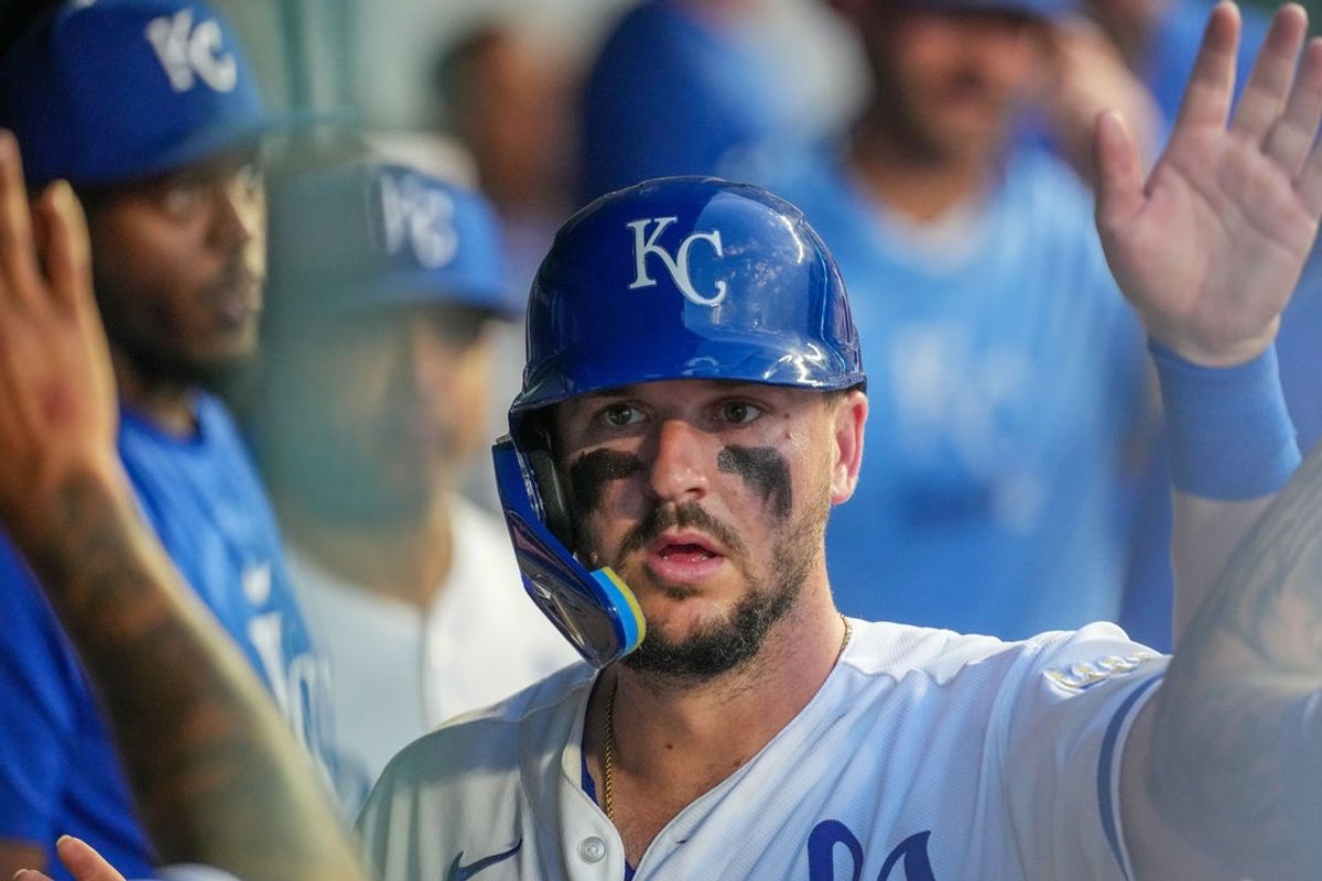 Jun 10, 2026; Kansas City, Missouri, USA; Kansas City Royals first baseman Vinnie Pasquantino (9) celebrates in the dugout against the Texas Rangers after scoring during the fifth inning at Kauffman Stadium. Mandatory Credit: Denny Medley-Imagn Images
