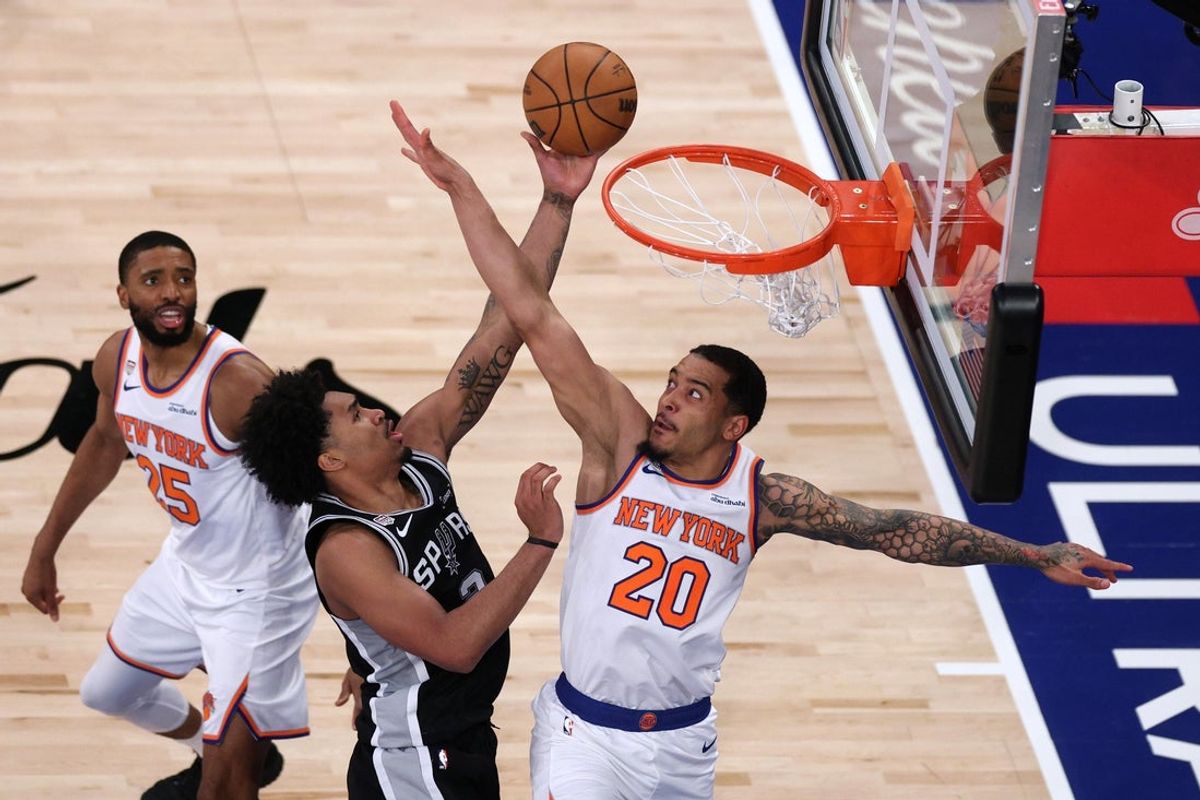 Jun 10, 2026; New York, New York, USA; San Antonio Spurs guard Dylan Harper (2) shoots the ball against New York Knicks forward Jeremy Sochan (20) and guard Mikal Bridges (25) during game four of the 2026 NBA Finals in the second quarter at Madison Square Garden. Mandatory Credit: Vincent Carchietta-Imagn Images