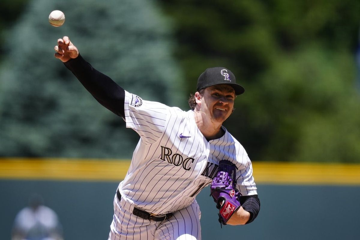 Jun 11, 2026; Denver, Colorado, USA;  Colorado Rockies starting pitcher Ryan Feltner (18) delivers a pitch in the first inning against the Chicago Cubs at Coors Field. Mandatory Credit: Ron Chenoy-Imagn Images