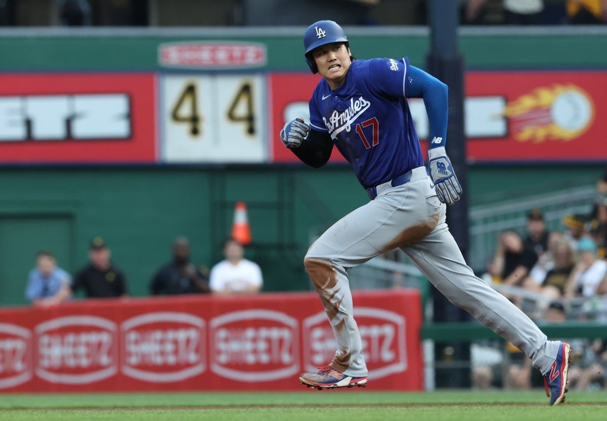 Jun 11, 2026; Pittsburgh, Pennsylvania, USA;  Los Angeles Dodgers designated hitter Shohei Ohtani (17) runs on a hit and run against the Pittsburgh Pirates during the fourth inning at PNC Park. Mandatory Credit: Charles LeClaire-Imagn Images