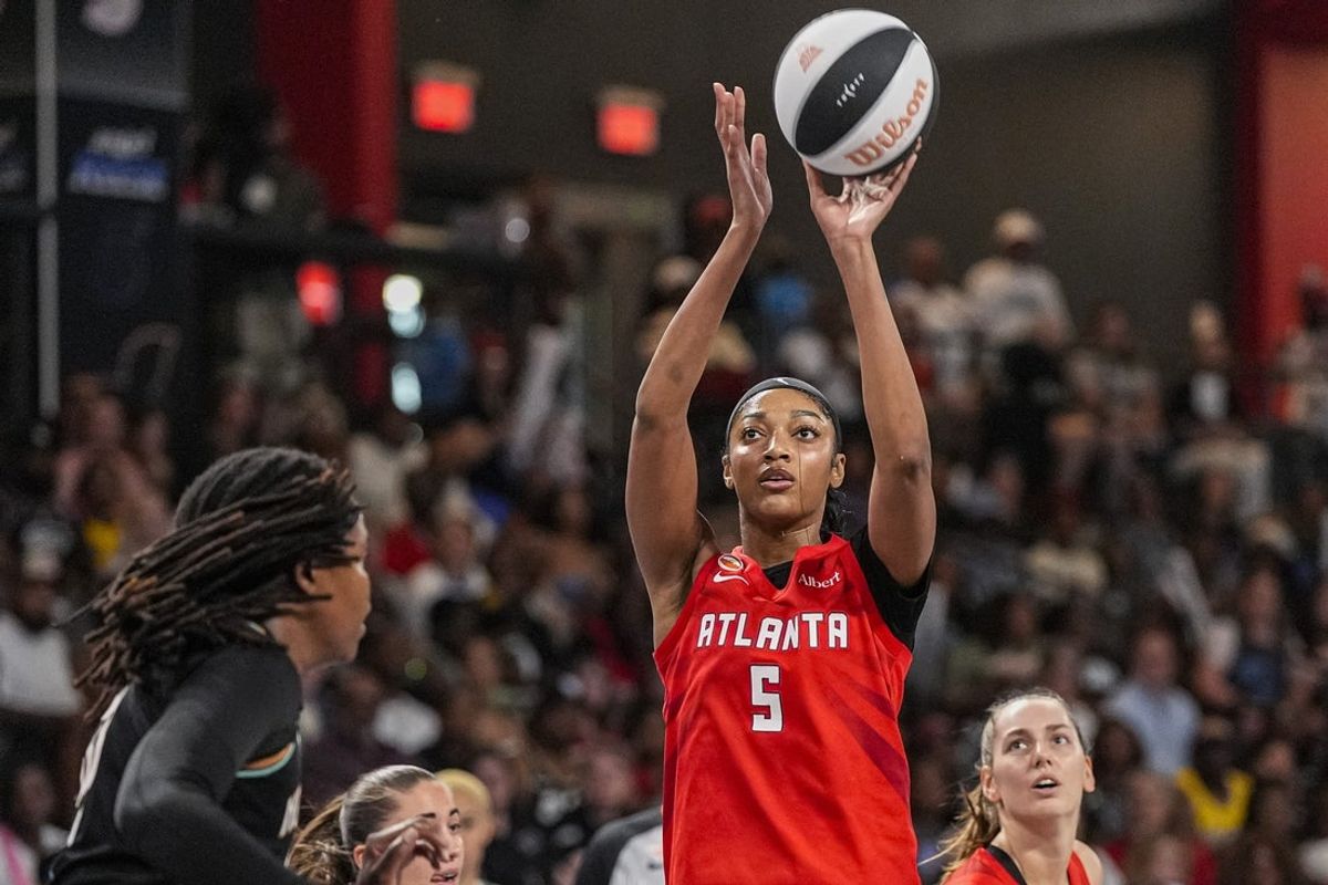 Jun 11, 2026; College Park, Georgia, USA; Atlanta Dream forward Angel Reese (5) shoots against the New York Liberty during the first half at Gateway Center Arena at College Park. Mandatory Credit: Dale Zanine-Imagn Images