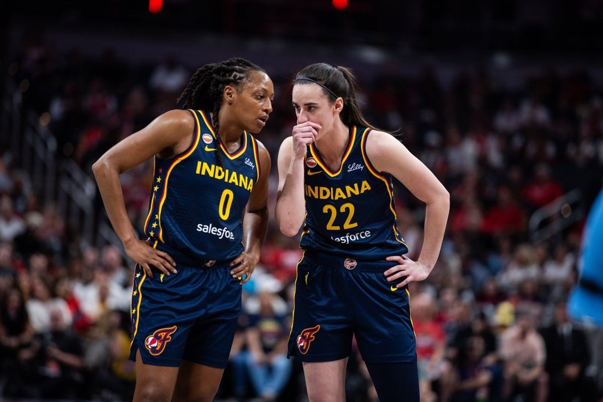 Jun 11, 2026; Indianapolis, Indiana, USA; Indiana Fever guard Kelsey Mitchell (0) and guard Caitlin Clark (22) in the first half against the Chicago Sky at Gainbridge Fieldhouse. Mandatory Credit: Trevor Ruszkowski-Imagn Images
