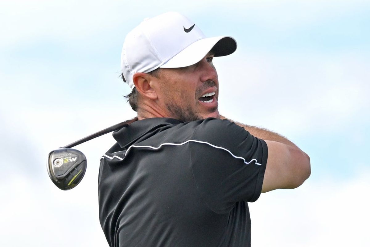 Jun 12, 2026; Caledon, Ontario, CAN;   Brooks Koepka hits his tee shot at the first hole during the second round of the RBC Canadian Open golf tournament. Mandatory Credit: Dan Hamilton-Imagn Images