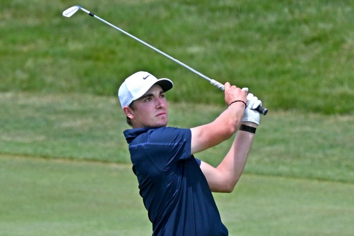 Jun 12, 2026; Caledon, Ontario, CAN;   Ben James hits his approach shot into the 18th green during the second round of the RBC Canadian Open golf tournament. Mandatory Credit: Dan Hamilton-Imagn Images
