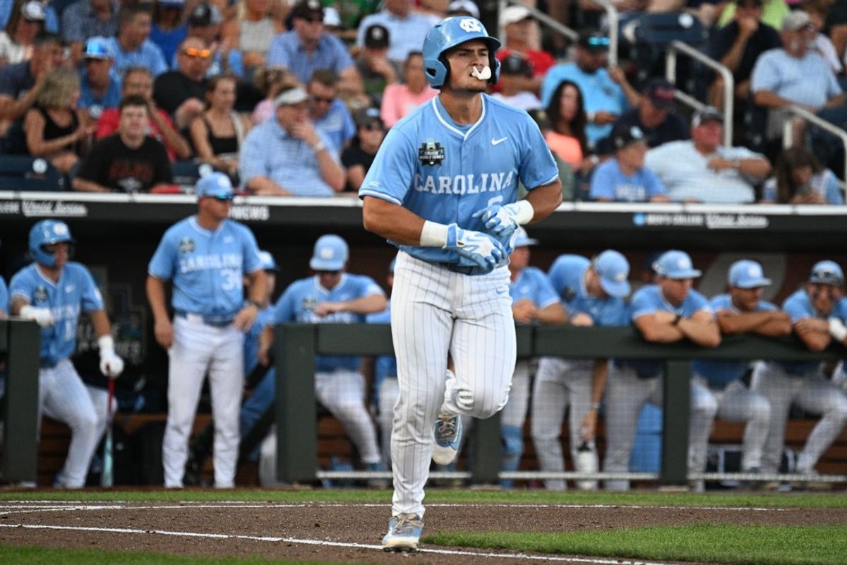 Jun 12, 2026; Omaha, NE, USA;  North Carolina Tar Heels designated hitter Macon Winslow (6) works a walk against the Mississippi Rebels third inning at Charles Schwab Field. Mandatory Credit: Steven Branscombe-Imagn Images