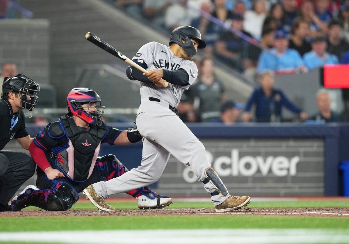 Jun 12, 2026; Toronto, Ontario, CAN; New York Yankees center fielder Trent Grisham (12) hits an RBI double against the Toronto Blue Jays during the sixth inning at Rogers Centre. Mandatory Credit: Nick Turchiaro-Imagn Images