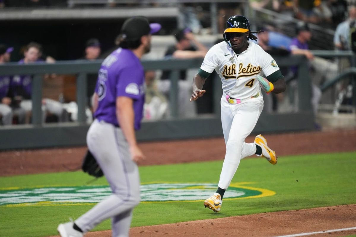 Jun 12, 2026; Summerlin, Nevada, USA; Athletics center fielder Lawrence Butler (4) scores during the seventh inning against the Colorado Rockies at the Las Vegas Ballpark. Mandatory Credit: Lucas Peltier-Imagn Images