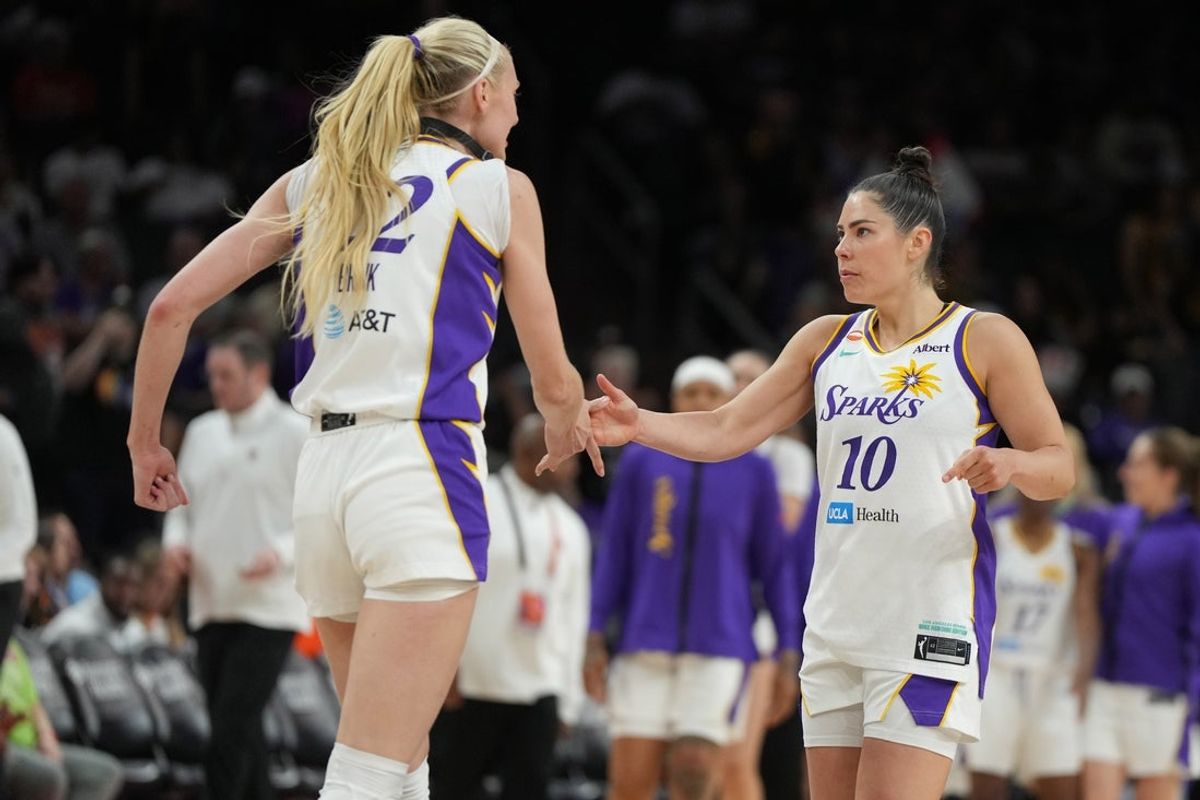 Jun 13, 2026; Phoenix, Arizona, USA; Los Angeles Sparks forward Cameron Brink (22) and guard Kelsey Plum (10) celebrate after defeating the Phoenix Mercury in overtime at Mortgage Matchup Center. Mandatory Credit: Rick Scuteri-Imagn Images