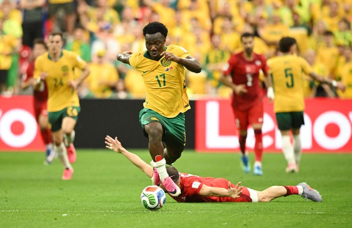 June 13, 2026; Vancouver, Canada; Australia's Nestory Irankunda in action as Turkey's Merih Demiral reacts.  Mandatory Credit: Anne-Marie Sorvin-Imagn Images
