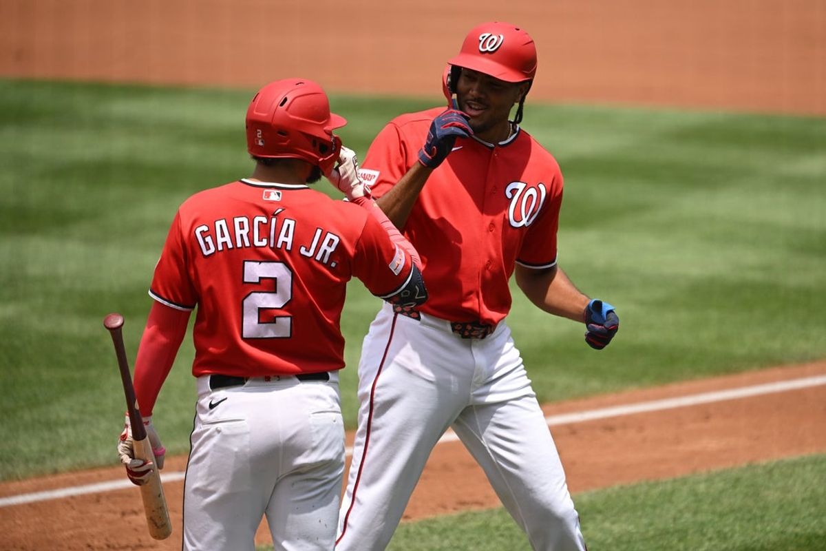 Jun 14, 2026; Washington, District of Columbia, USA; Washington Nationals right fielder James Wood (29) celebrates hitting a home run with first baseman Luis Garcia Jr. (2) against the Seattle Mariners during the first inning at Nationals Park. Mandatory Credit: Rafael Suanes-Imagn Images