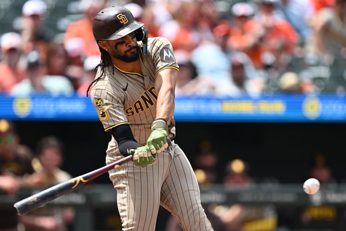 Jun 14, 2026; Baltimore, Maryland, USA;  San Diego Padres outfielder Fernando Tatis Jr. (23) hits a RBI single in the second inning against the Baltimore Orioles at Oriole Park at Camden Yards. Mandatory Credit: Jamie Sabau-Imagn Images