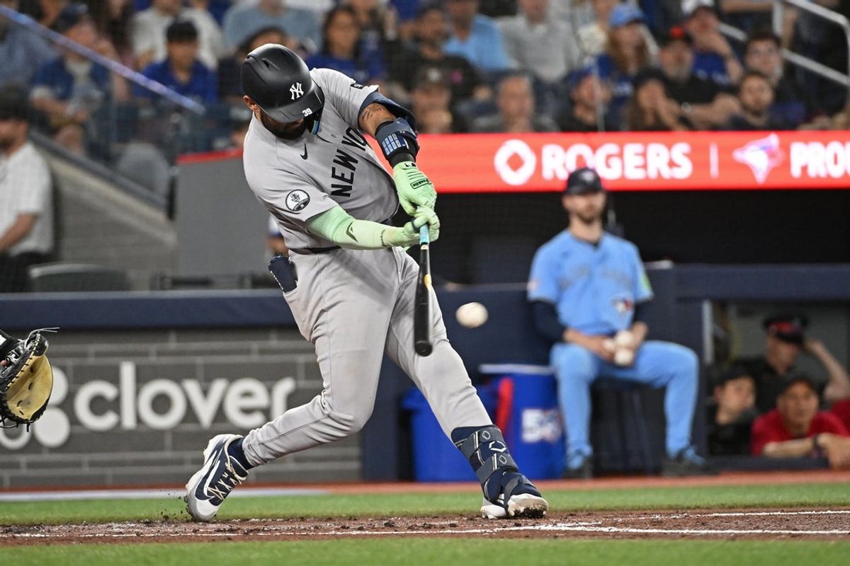 Jun 14, 2026; Toronto, Ontario, CAN; New York Yankees catcher Ali Sanchez (39) hits a RBI double in the second inning against the Toronto Blue Jays at Rogers Centre. Mandatory Credit: Gerry Angus-Imagn Images