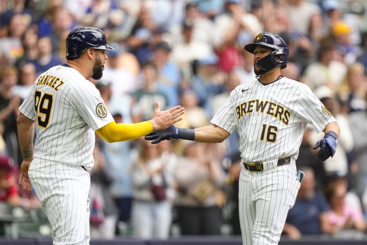 Jun 14, 2026; Milwaukee, Wisconsin, USA;  Milwaukee Brewers right fielder Blake Perkins (16) celebrates with Gary Sanchez (99) after hitting a home run during the fourth inning against the Philadelphia Phillies at American Family Field. Mandatory Credit: Jeff Hanisch-Imagn Images