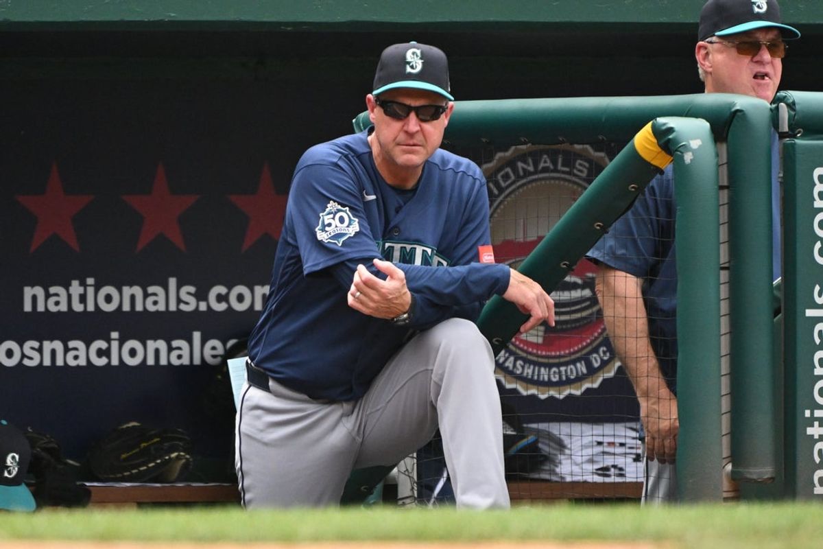 Jun 14, 2026; Washington, District of Columbia, USA; Seattle Mariners manager Dan Wilson (6) watches from the dugout against the Washington Nationals during the fifth inning at Nationals Park. Mandatory Credit: Rafael Suanes-Imagn Images